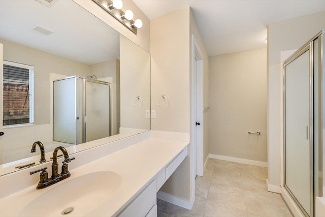 full bathroom featuring vanity, visible vents, baseboards, a stall shower, and tile patterned floors