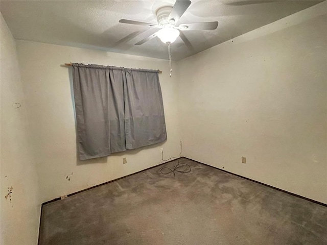 unfurnished room featuring carpet and a ceiling fan