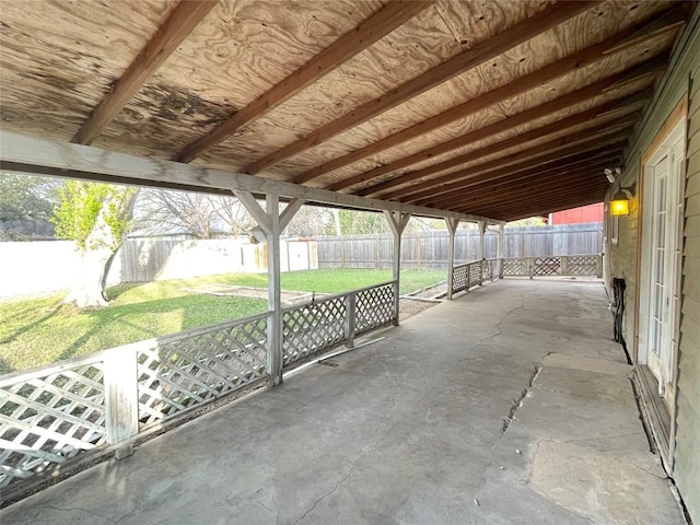 view of patio featuring an outbuilding, a fenced backyard, and a shed