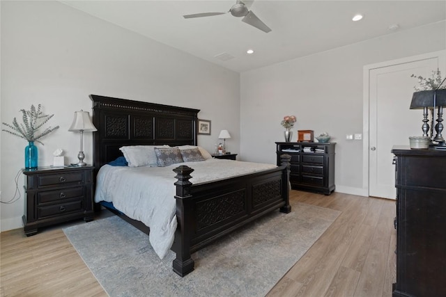 bedroom featuring light wood-style flooring, recessed lighting, and baseboards