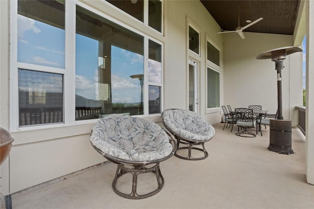 view of patio featuring outdoor dining space and a ceiling fan