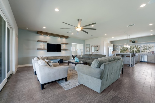 living room with visible vents, baseboards, recessed lighting, a ceiling fan, and dark wood-style flooring