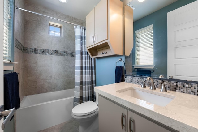 bathroom featuring shower / bathtub combination with curtain, toilet, tile patterned flooring, decorative backsplash, and vanity