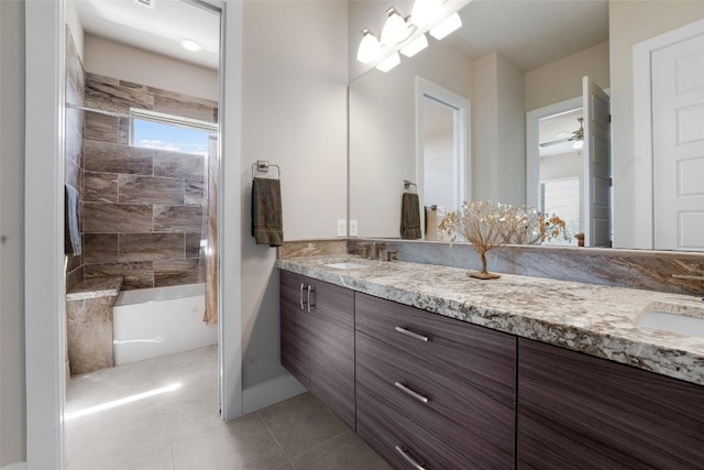 bathroom featuring tile patterned floors, double vanity, a ceiling fan, and a sink