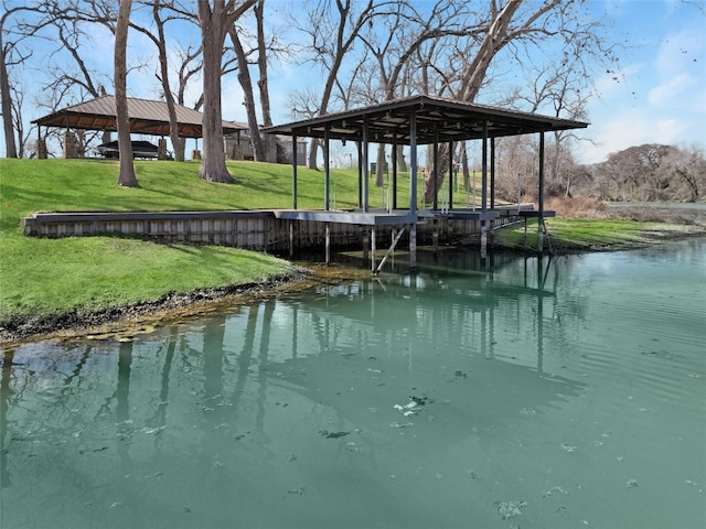 view of dock featuring a gazebo, a yard, and a water view