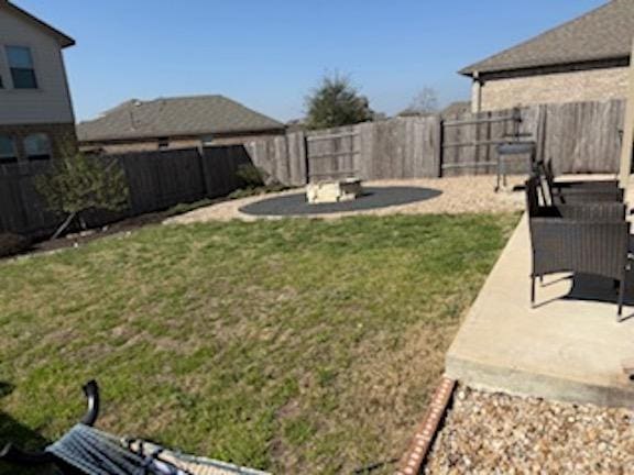 view of yard with a fenced backyard and a patio area