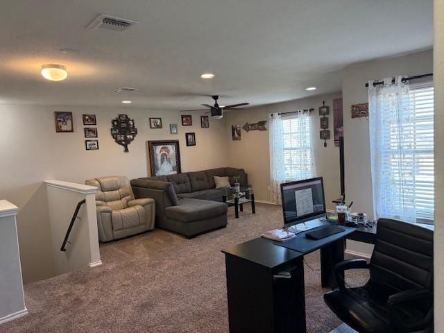 living area featuring recessed lighting, visible vents, carpet flooring, and a ceiling fan