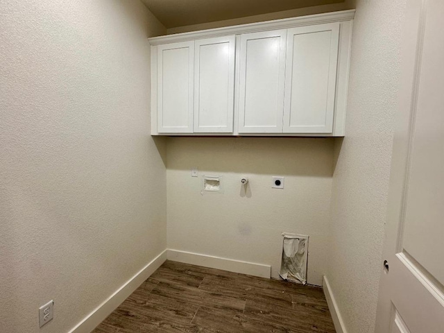laundry area featuring washer hookup, hookup for an electric dryer, cabinet space, baseboards, and dark wood-style floors