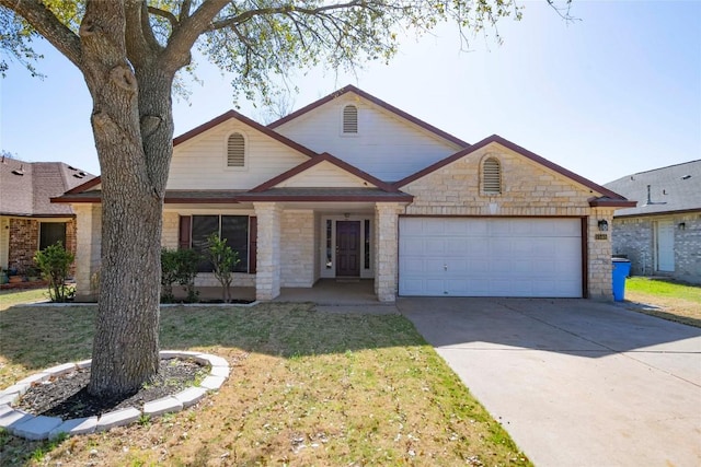 view of front facade with stone siding, an attached garage, driveway, and a front yard