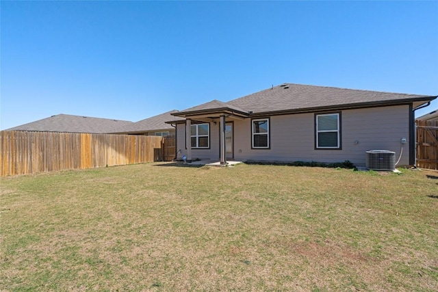 105 Krause Springs Dr, Hutto, TX 78634 - rear view of house with a fenced backyard and a shingled roof
