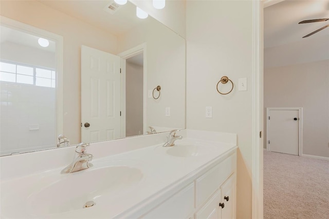 full bathroom with ceiling fan, double vanity, visible vents, and a sink