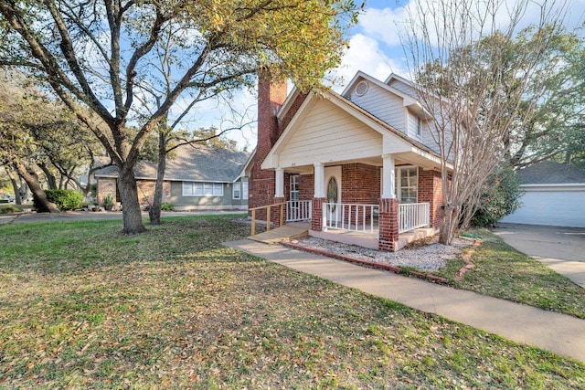bungalow-style home featuring a chimney, brick siding, a front lawn, an outdoor structure, and a porch