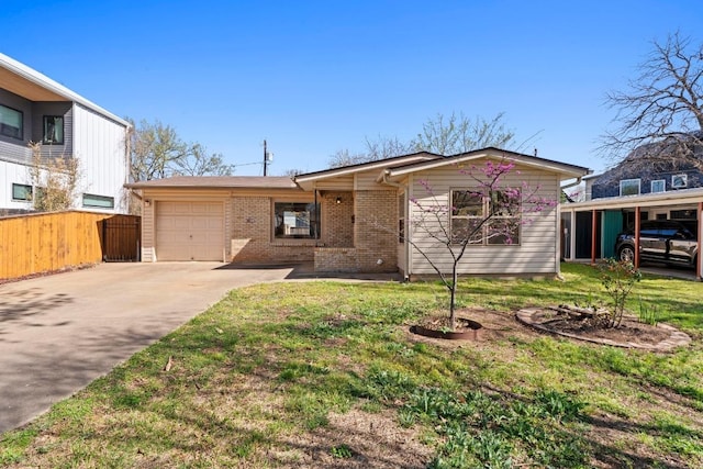 view of front of property featuring brick siding, a front lawn, fence, concrete driveway, and a garage