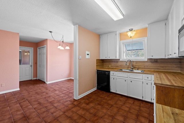 kitchen featuring a chandelier, dishwasher, white cabinets, a textured ceiling, and a sink