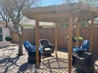 view of patio / terrace featuring fence