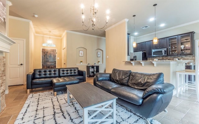 10033 Longhorn Skwy, Dripping Springs, TX 78620 - living room featuring stone tile floors, a chandelier, and ornamental molding