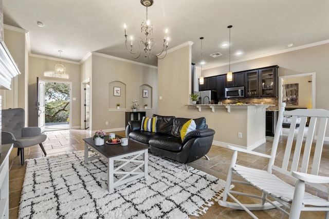 10033 Longhorn Skwy, Dripping Springs, TX 78620 - living area with a chandelier, baseboards, stone tile flooring, ornamental molding, and recessed lighting