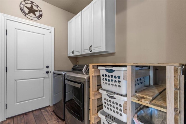 laundry room featuring cabinet space, dark wood-style floors, and washing machine and dryer