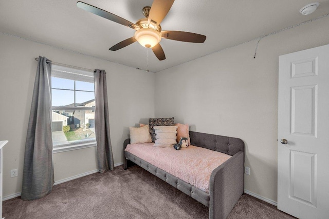 bedroom featuring a ceiling fan, carpet, and baseboards