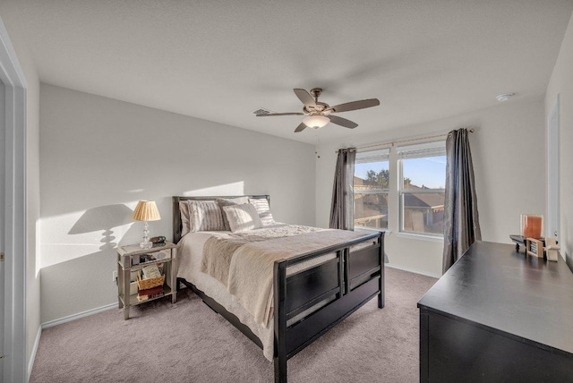 bedroom featuring baseboards, carpet, and a ceiling fan