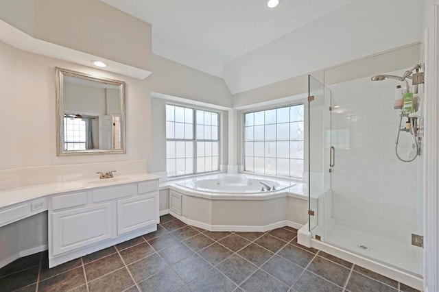 8320 Pommel Dr, Austin, TX 78759 - bathroom featuring a bath, vaulted ceiling, a stall shower, vanity, and tile patterned flooring