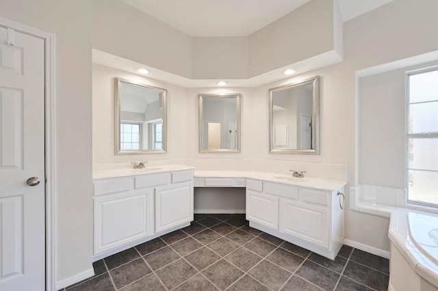 bathroom with tile patterned flooring, plenty of natural light, and vanity