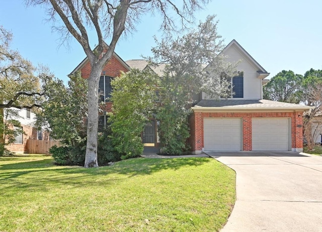 traditional-style home with driveway, a front lawn, fence, an attached garage, and brick siding
