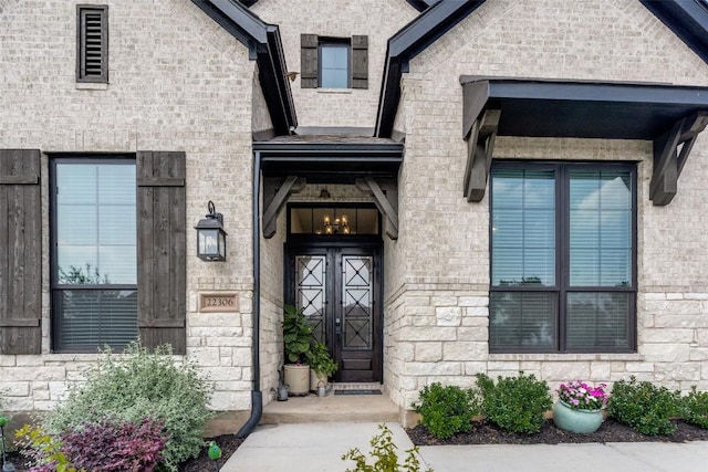 view of exterior entry with stone siding