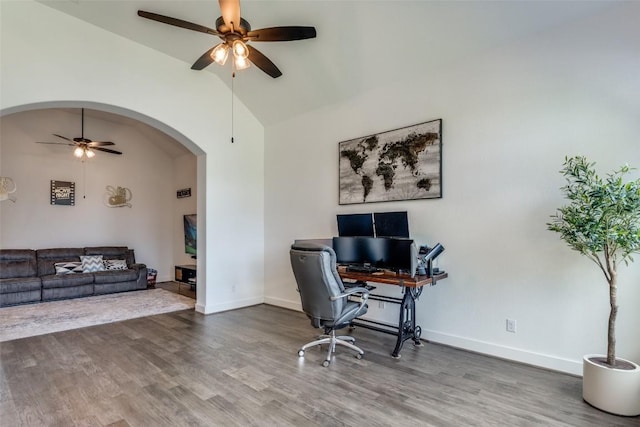 22306 Cape Travis Bnd, Lago Vista, TX 78645 - office area with arched walkways, baseboards, a ceiling fan, and wood finished floors