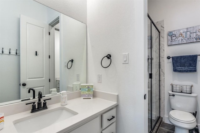 22306 Cape Travis Bnd, Lago Vista, TX 78645 - bathroom featuring a shower stall, vanity, and toilet