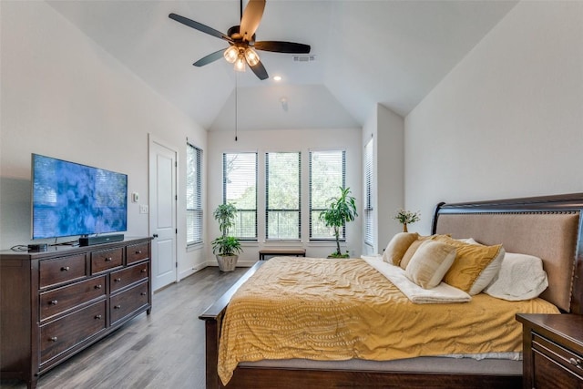 22306 Cape Travis Bnd, Lago Vista, TX 78645 - bedroom with visible vents, a ceiling fan, wood finished floors, baseboards, and lofted ceiling