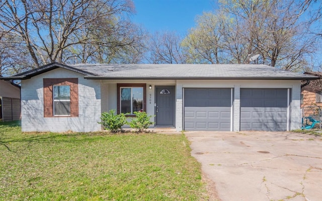 ranch-style home featuring concrete driveway, a garage, brick siding, and a front lawn