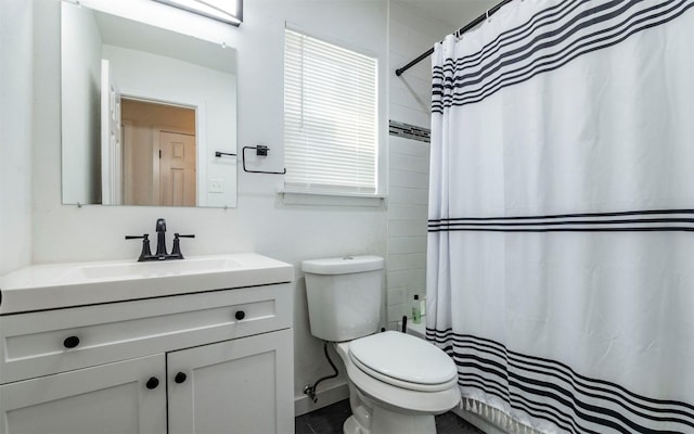 bathroom featuring vanity and toilet