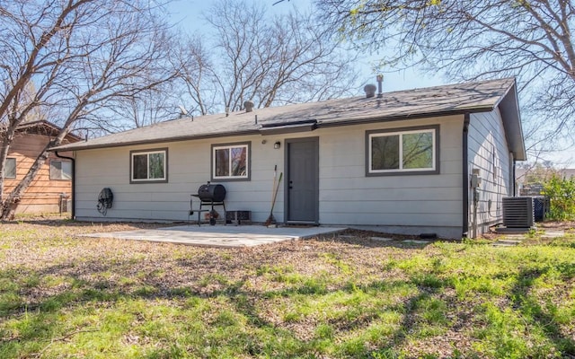 rear view of house with a patio area and central air condition unit