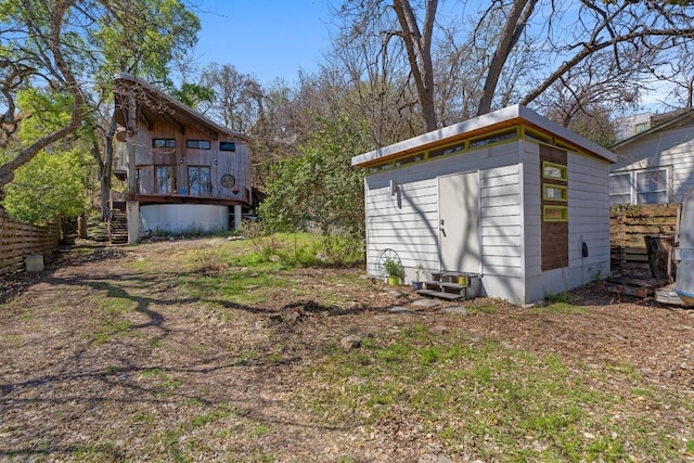 view of yard featuring entry steps and an outdoor structure