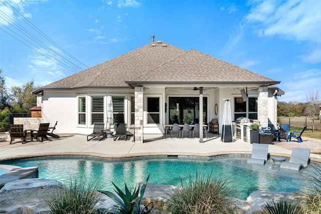 view of pool featuring a fenced in pool, fence, a ceiling fan, and a patio area