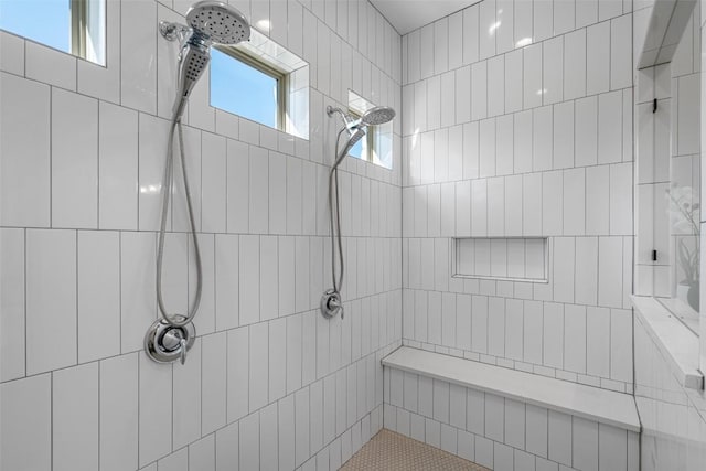 full bath featuring tiled shower