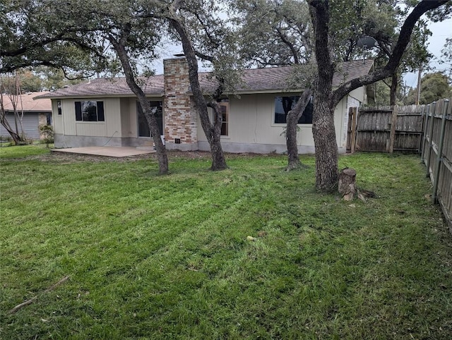 view of yard featuring a patio and a fenced backyard