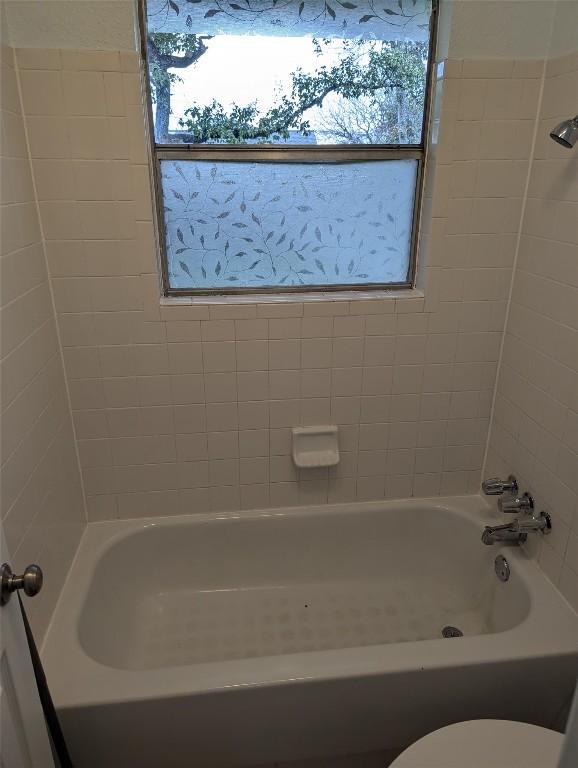 full bath featuring shower / bathing tub combination and toilet