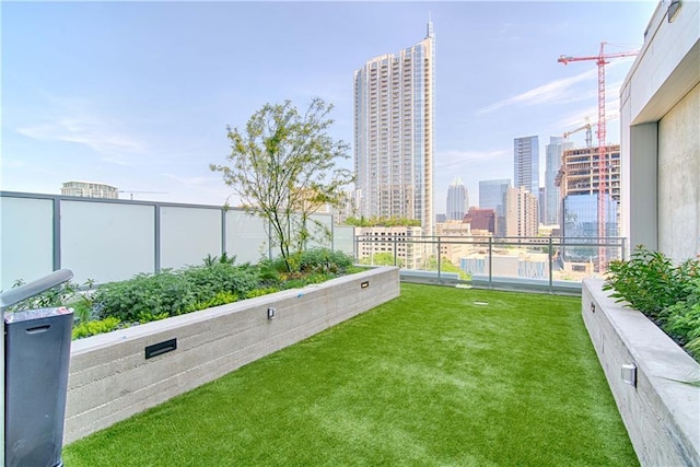 exterior space with a yard and a city view