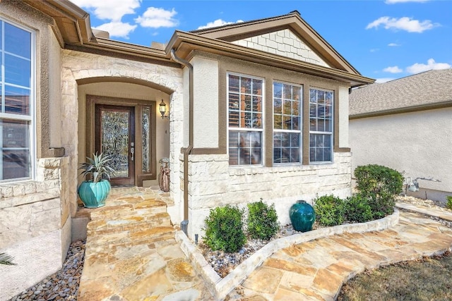 property entrance with stone siding