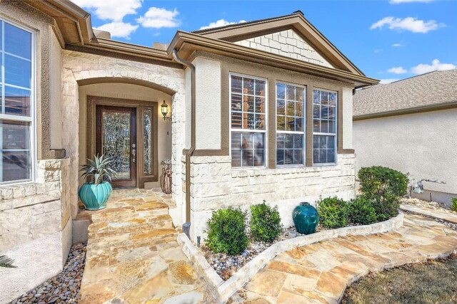 214 Apache Mountain Ln, Georgetown, TX 78633 - doorway to property with stone siding and stucco siding