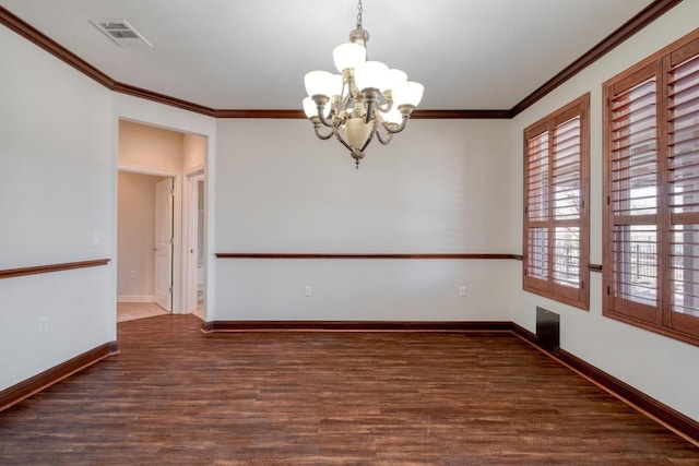 214 Apache Mountain Ln, Georgetown, TX 78633 - empty room featuring visible vents, crown molding, wood finished floors, baseboards, and a notable chandelier