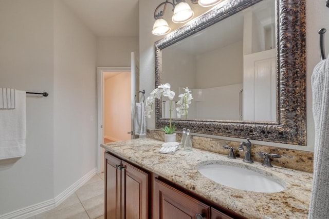 214 Apache Mountain Ln, Georgetown, TX 78633 - bathroom with vanity, baseboards, and tile patterned floors
