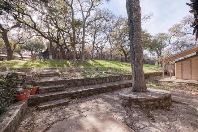 view of yard with a patio and fence