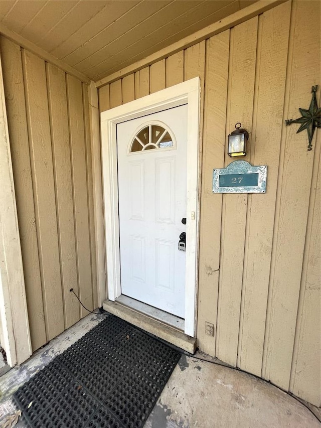 doorway to property with board and batten siding