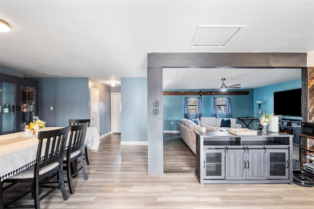 10505 Ruidosa St, Austin, TX 78719 - kitchen featuring baseboards, light wood-style floors, and a ceiling fan