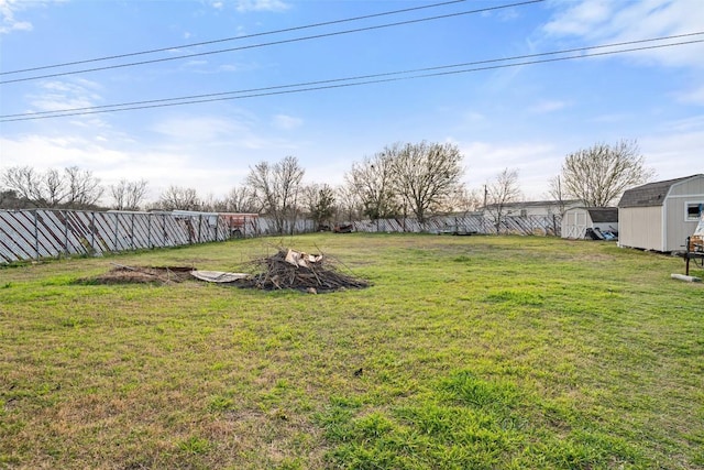 10505 Ruidosa St, Austin, TX 78719 - view of yard with an outbuilding, a shed, and a fenced backyard