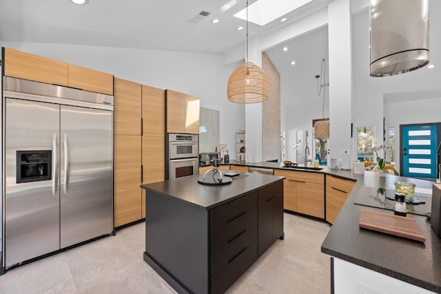 203 Golf Crest Ln, Lakeway, TX 78734 - kitchen with appliances with stainless steel finishes, dark countertops, high vaulted ceiling, a skylight, and modern cabinets
