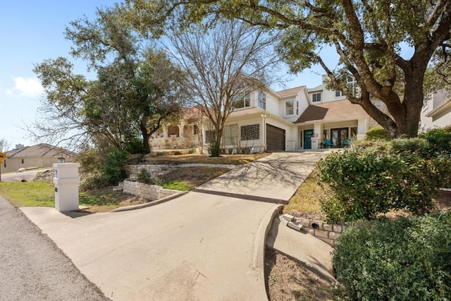 203 Golf Crest Ln, Lakeway, TX 78734 - view of front facade with driveway and an attached garage